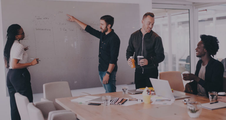 a leader delegating to his team in a meeting